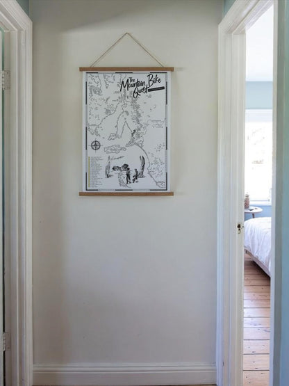 South Australia Mountain Bike Quest scratch map displayed in a wooden hanging frame in a hallway