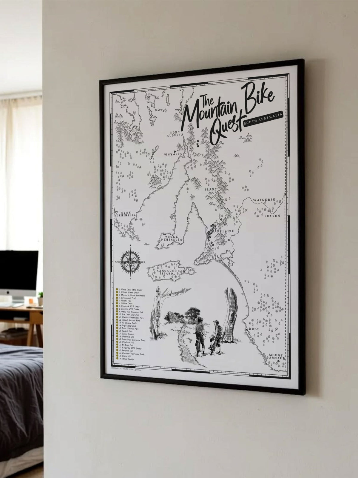 Framed South Australia Mountain Bike Quest scratch map displayed on a bedroom wall