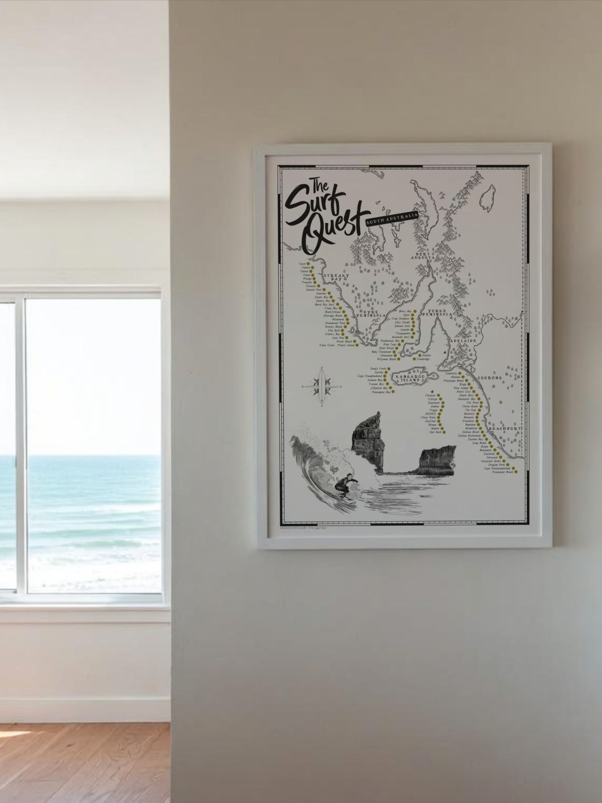 South Australia Surf Quest scratch map hanging on a bedroom wall beside a window overlooking the ocean
