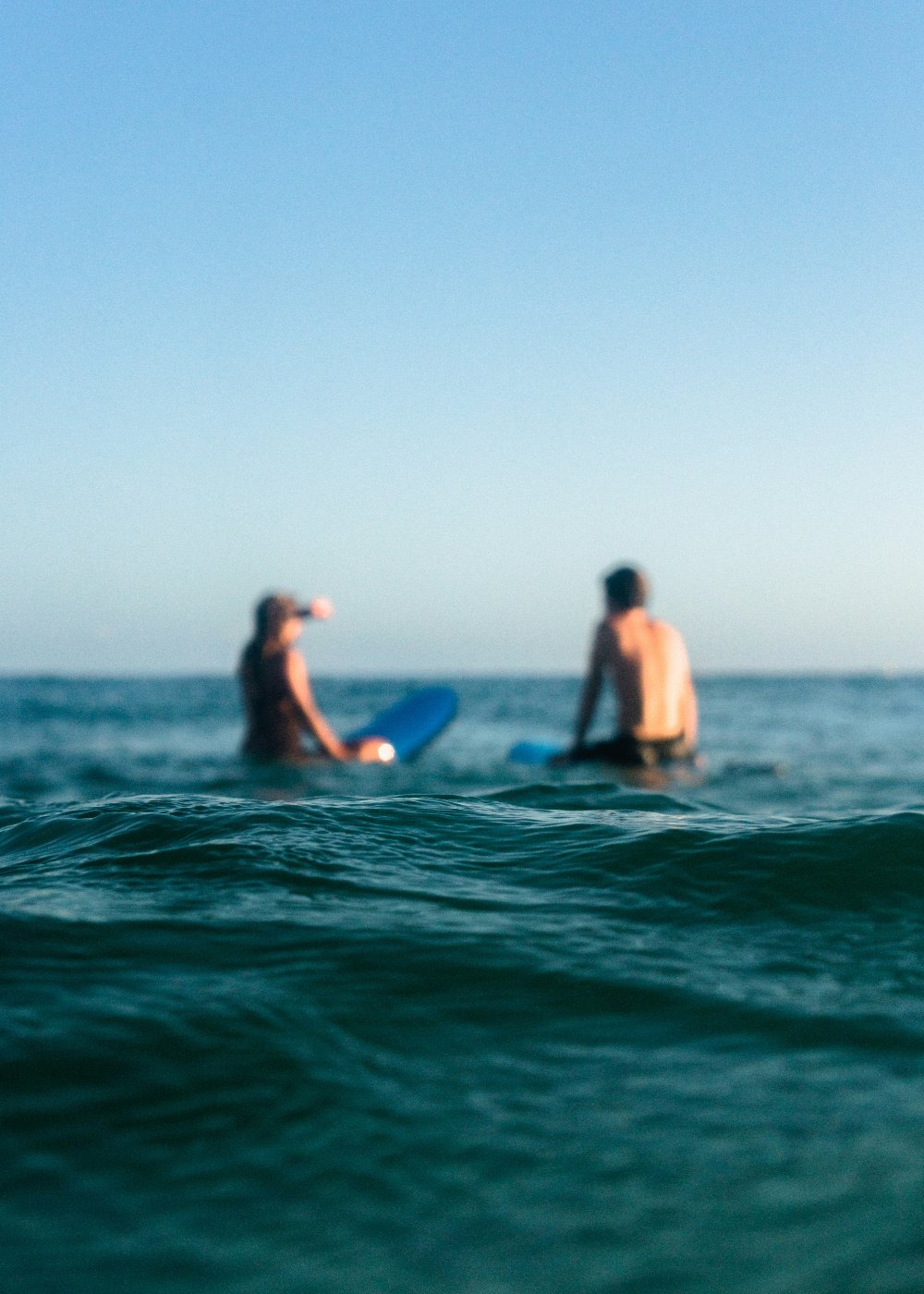 Two surfers waiting for the next set of wave. The Quest Maps Outdoor Scratch Maps Website